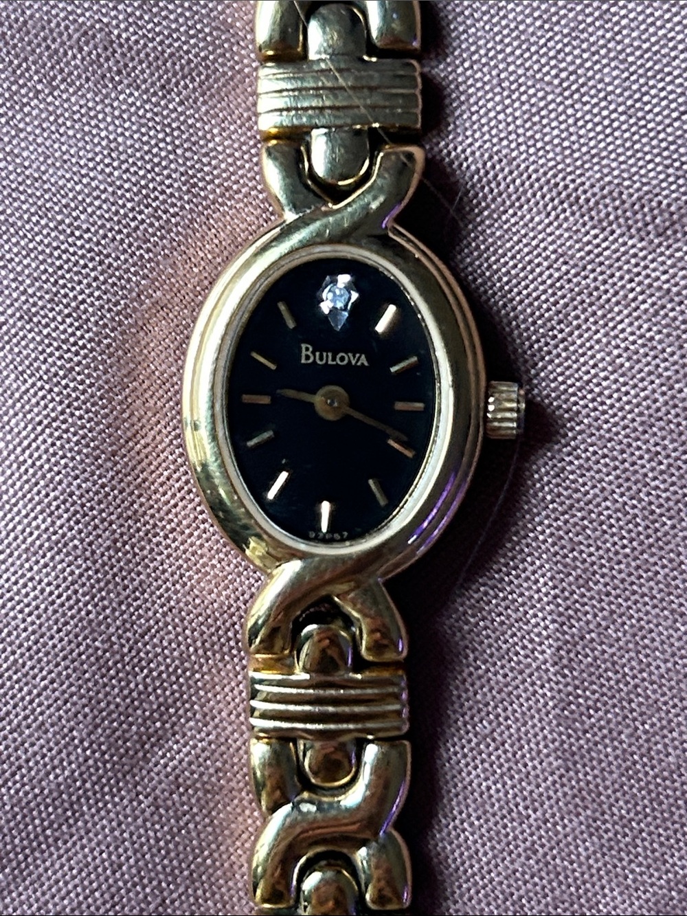 Bulova Gold Tone Bracelet Watch with Black Dial and Crystal Accent